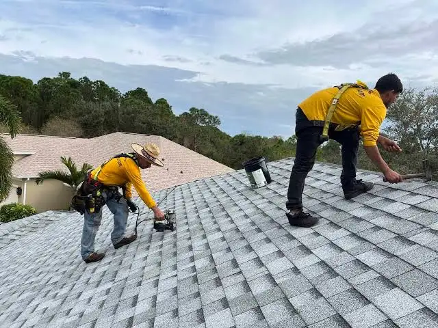Beautiful newly installed residential roof on a modern American home with fresh clean shingles